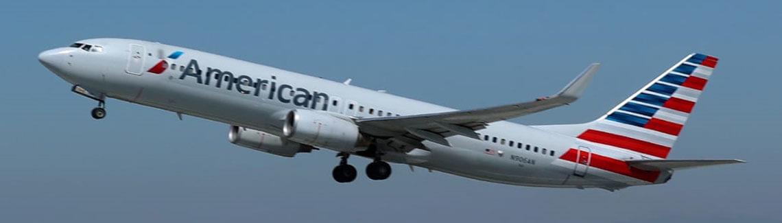 Picture of an American Airlines airplane returning dental patients to the U.S. after having dental work at Premier Holistic Dental in Costa Rica.  The picture depicts the round-trip vacation opportunities available for patients having dental work in Costa Rica.