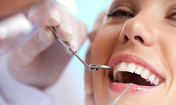 Picture of a smiling woman patient with pertfect white teeth having a Holistic Dental treatment at Premier Holistic Dental in beautiful Costa Rica.