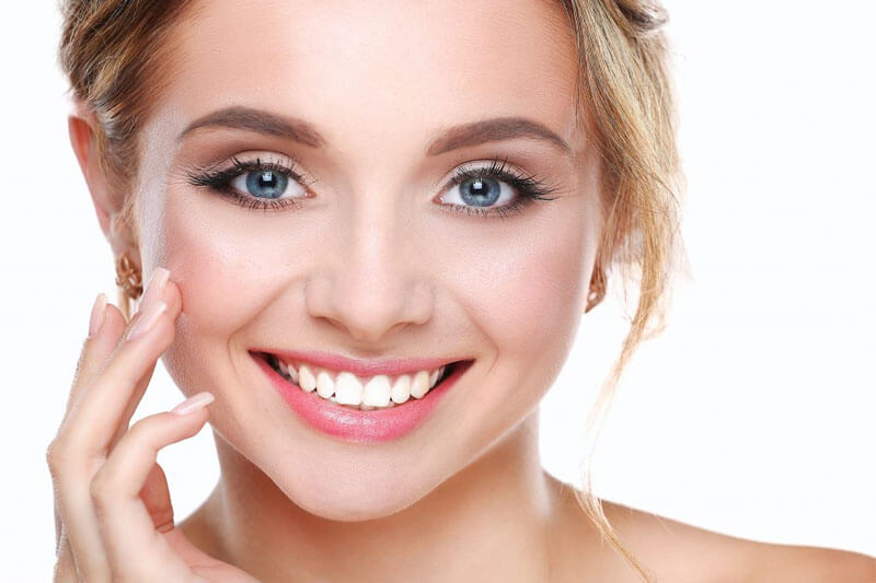 Picture of a smiling woman with short blonde hair, happy with the safe mercury removal dental procedure she had at Premier Holistic Dental in Costa Rica.